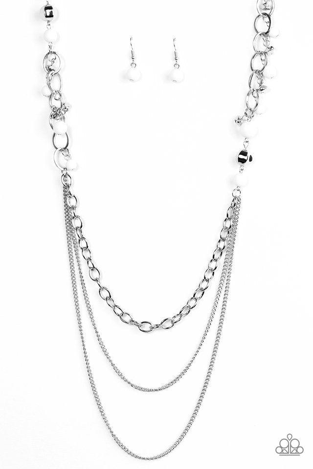 Paparazzi Accessories Carefree And Capricious - White Polished white and faceted silver beads trickle along shimmery silver hoops for an asymmetrical look. The colorful beading gives way to layers of shimmery silver chain for a seasonal finish. Features a