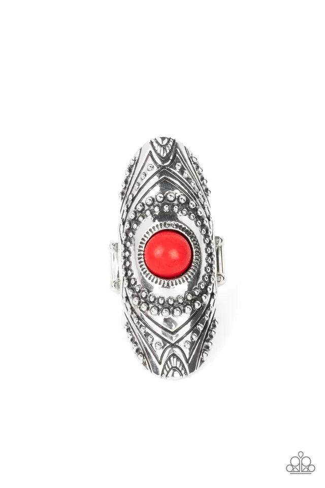Paparazzi Accessories Rural Residence - Red A fiery red stone creates a colorful centerpiece for an oversized elongated silver frame. Embellished with studded texture and geometric designs, the patterned frame results in a hypnotizing lure atop the f