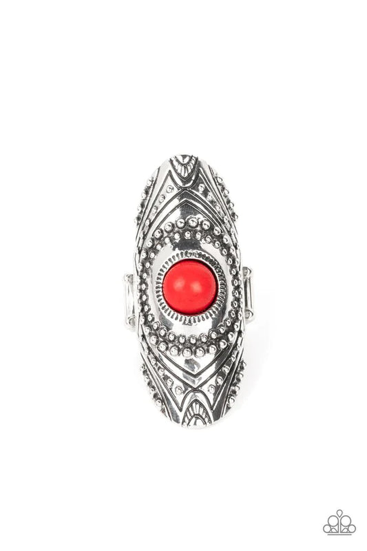 Paparazzi Accessories Rural Residence - Red A fiery red stone creates a colorful centerpiece for an oversized elongated silver frame. Embellished with studded texture and geometric designs, the patterned frame results in a hypnotizing lure atop the f