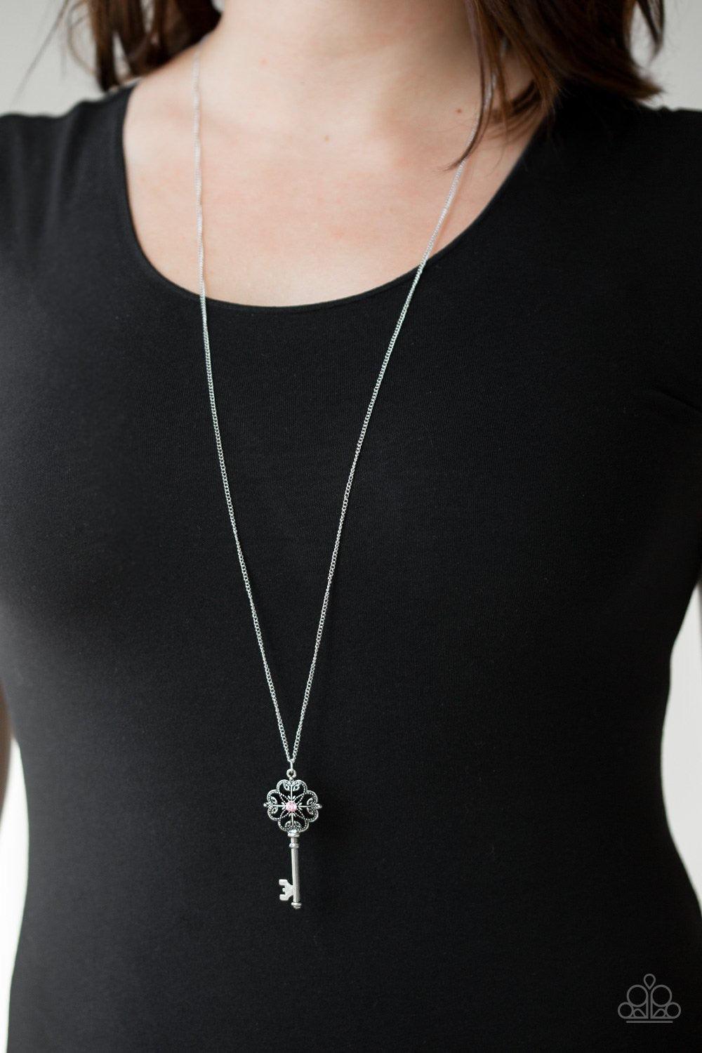 Paparazzi Accessories Got It On Lock - Silver Dotted with a glittery hematite rhinestone, a vintage inspired key pendant swings from the bottom of an elegantly elongated silver chain for a whimsical look. Features an adjustable clasp closure. Jewelry