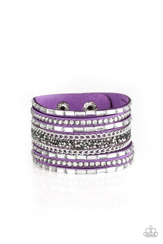 Paparazzi Accessories Rhinestone Rumble - Purple White emerald-cut rhinestones, smoky round rhinestones, and metallic prism-shaped rhinestones are sprinkled along strands of vivacious purple suede. Shimmery silver chain is added to the mix for a sassy ind