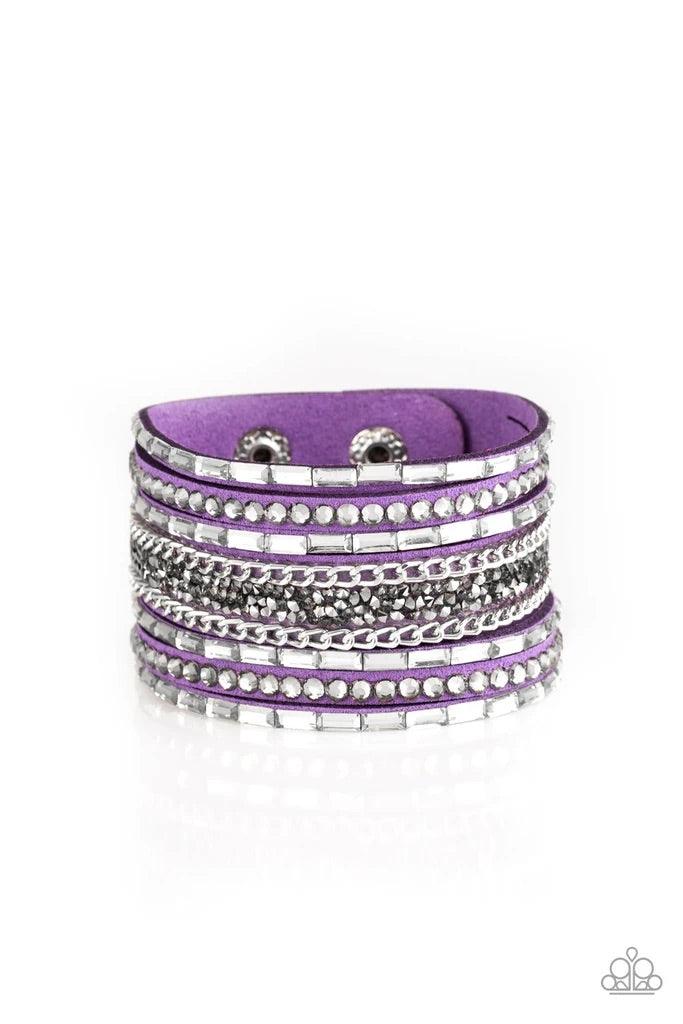 Paparazzi Accessories Rhinestone Rumble - Purple White emerald-cut rhinestones, smoky round rhinestones, and metallic prism-shaped rhinestones are sprinkled along strands of vivacious purple suede. Shimmery silver chain is added to the mix for a sassy ind