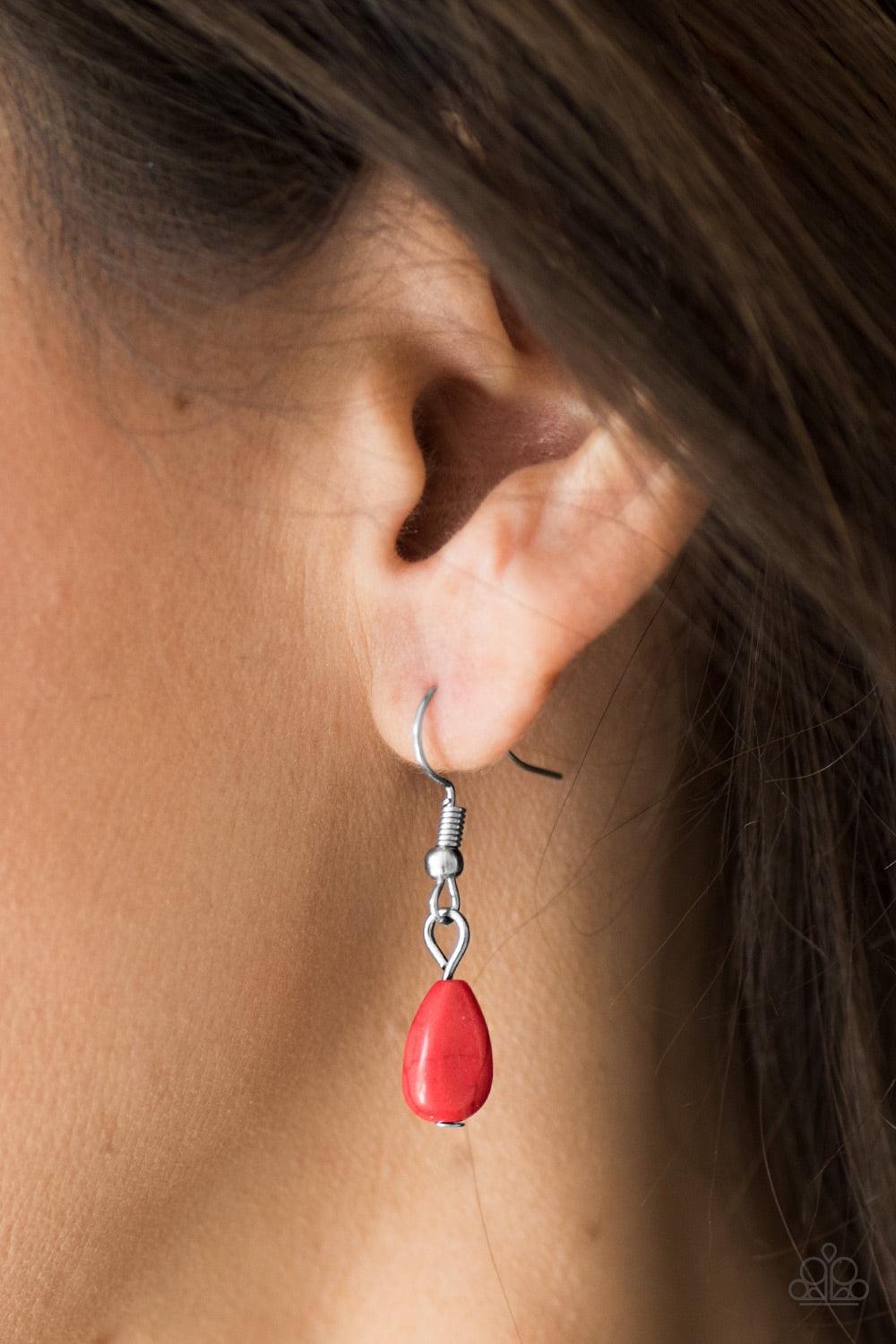 Paparazzi Accessories Stone Solo - Red Chiseled into a tranquil teardrop, a bright red stone swings from the bottom of a silver chain, creating an earthy pendant below the collar. Features an adjustable clasp closure. Jewelry