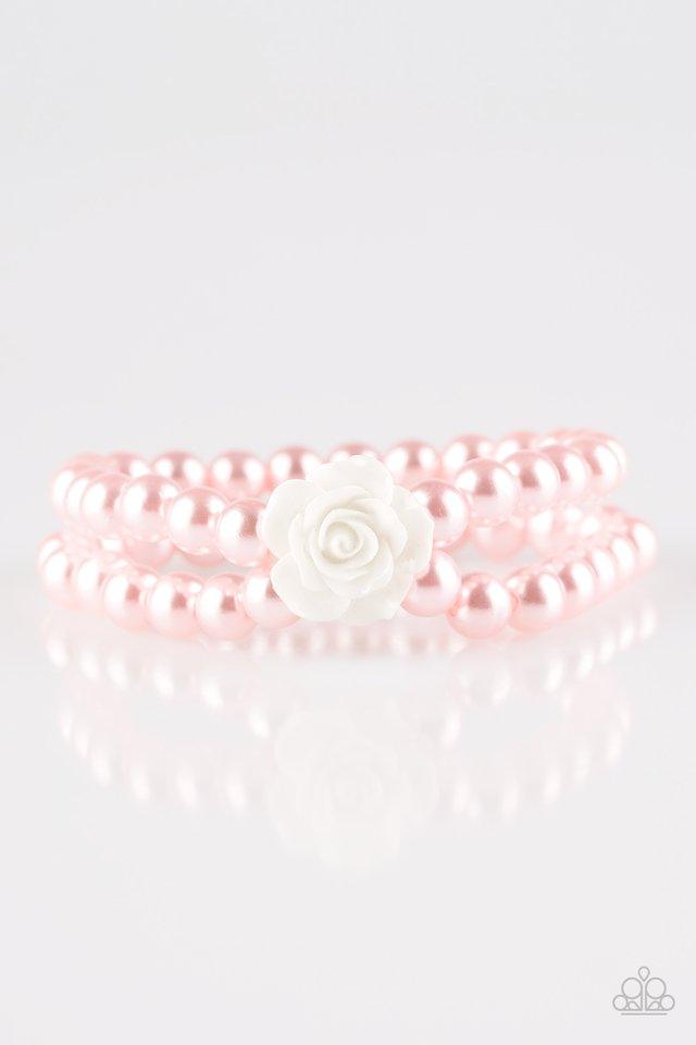 Paparazzi Accessories Posh and Posy - Pink Connected by a flirty white resin rose, classic pink pearls are threaded along stretchy bands around the wrist for a vintage inspired fashion. Sold as one individual bracelet Jewelry