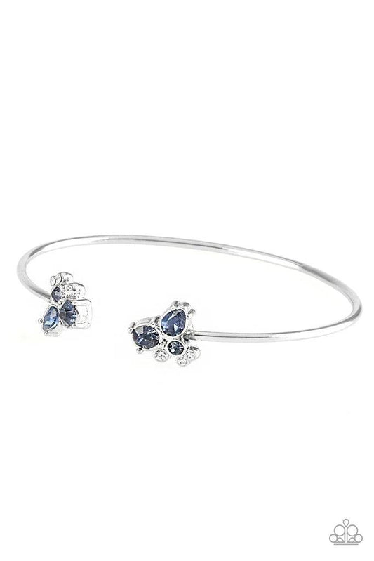 Paparazzi Accessories Going for Glitter - Blue Varying in shape, glittery blue and white rhinestones join at both ends of a dainty silver cuff, creating refined fittings. Sold as one individual bracelet. Jewelry