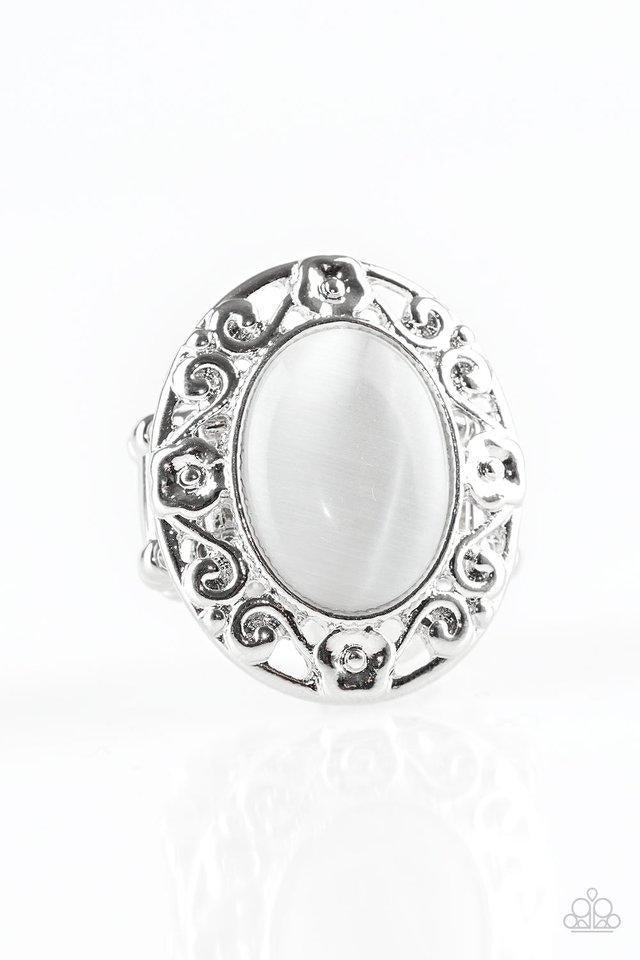 Paparazzi Accessories Moonlit Marigold - White Shimmery floral-like filigree swirls around a glowing white moonstone center, creating a whimsical centerpiece atop the finger. Features a stretchy band for a flexible fit. Sold as one individual ring. Jewelr