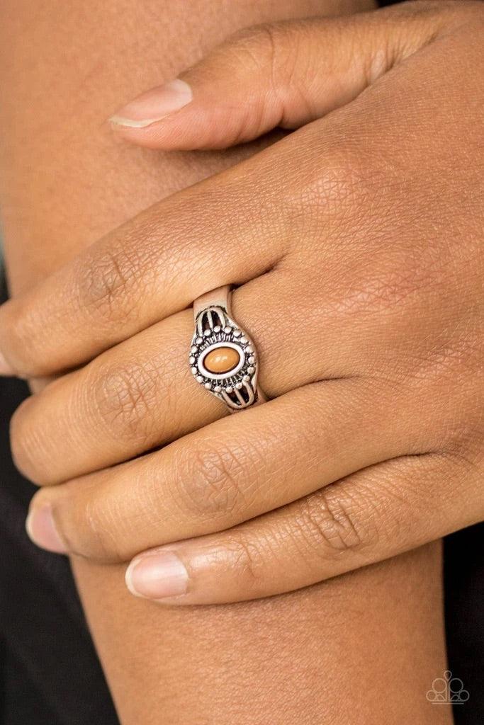 Paparazzi Accessories Right on TREK - Brown A refreshing brown bead is pressed into the center of a dainty silver band radiating with tribal inspired textures for a seasonal look. Features a dainty stretchy band for a flexible fit. Sold as one individual