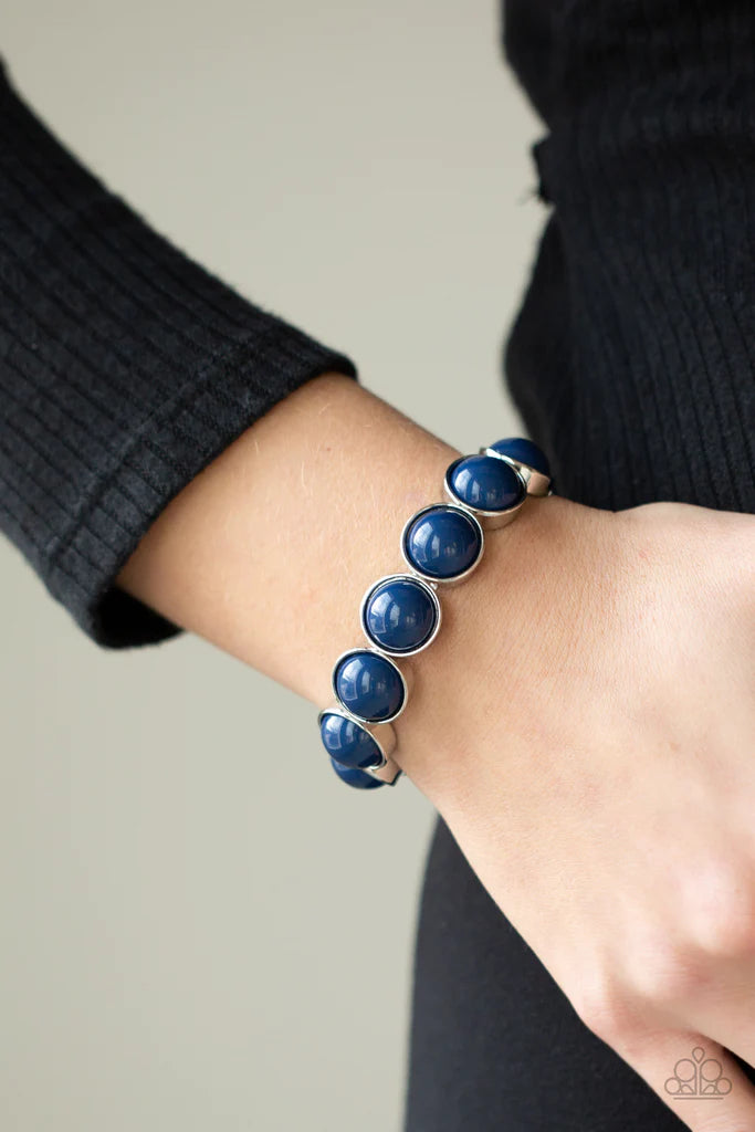 Paparazzi Accessories POP, Drop, and Roll - Blue Dotted with polished blue beads, studded floral and metallic rope-like silver frames are threaded along stretchy bands around the wrist for a colorfully bubbly fashion. Sold as one individual bracelet. Brac