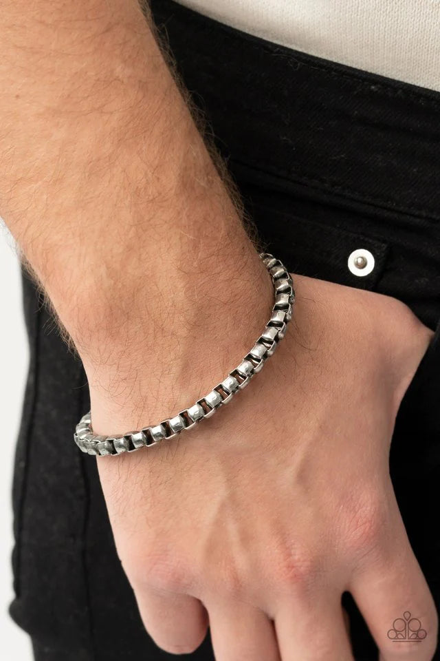 Paparazzi Accessories Armed Combat - Silver Brushed in a rustic shimmer, a chunky strand of silver box chain drapes around the wrist for a gritty industrial look. Features an adjustable clasp closure. Sold as one individual bracelet. Jewelry