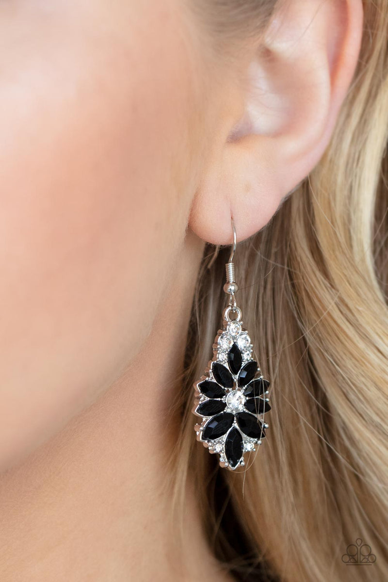 Paparazzi Accessories Gala Goddess - Black Sprinkled with dainty white rhinestones, an explosion of regal marquise cut black rhinestones flare out from a solitaire white rhinestone center for a fabulously floral flair. Earring attaches to a standard fishh