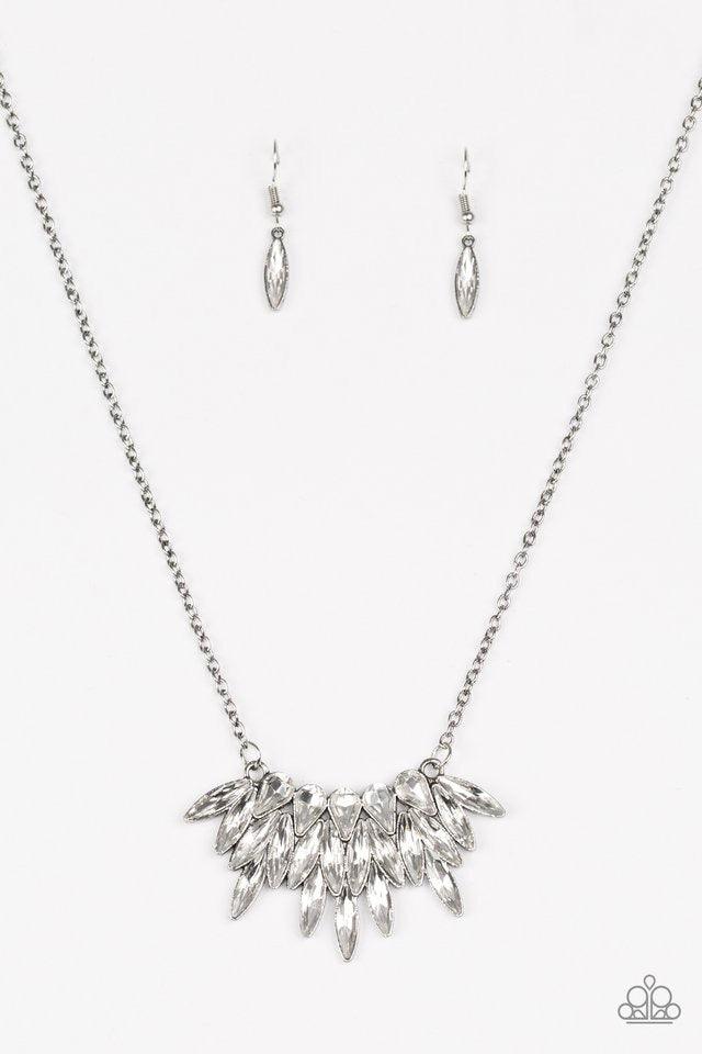 Paparazzi Accessories Crowning Moment - White Featuring regal teardrop and marquise style cuts, glittery white rhinestones fan from the bottom of a lengthened silver chain for a dramatic look. Features an adjustable clasp closure. Sold as one individual n