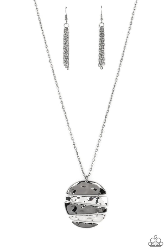 Paparazzi Accessories Shattered Sunset - Black Slices of hammered silver and gunmetal frames linked into an abstract mixed metallic palette at the bottom of a lengthened silver chain, creating an edgy centerpiece. Features an adjustable clasp closure. Sol
