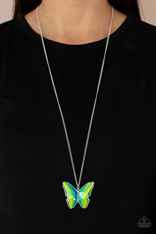 Paparazzi Accessories The Social Butterfly Effect ~Green Featuring a UV effect, dramatically faceted green and blue gems adorn the wings of a silver butterfly, creating an ethereal pendant at the bottom of a lengthened silver chain. Features an adjustable