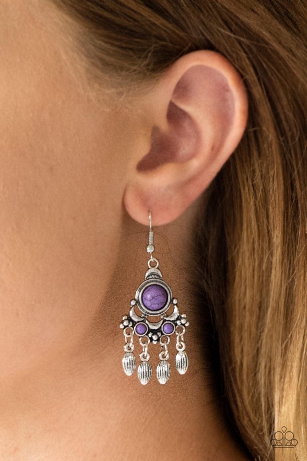 Paparazzi Accessories No Place Like HOMESTEAD - Purple Dotted with vivacious purple stone accents, an ornate silver frame gives way to a silver beaded fringe for a seasonal look. Earring attaches to a standard fishhook fitting. Jewelry