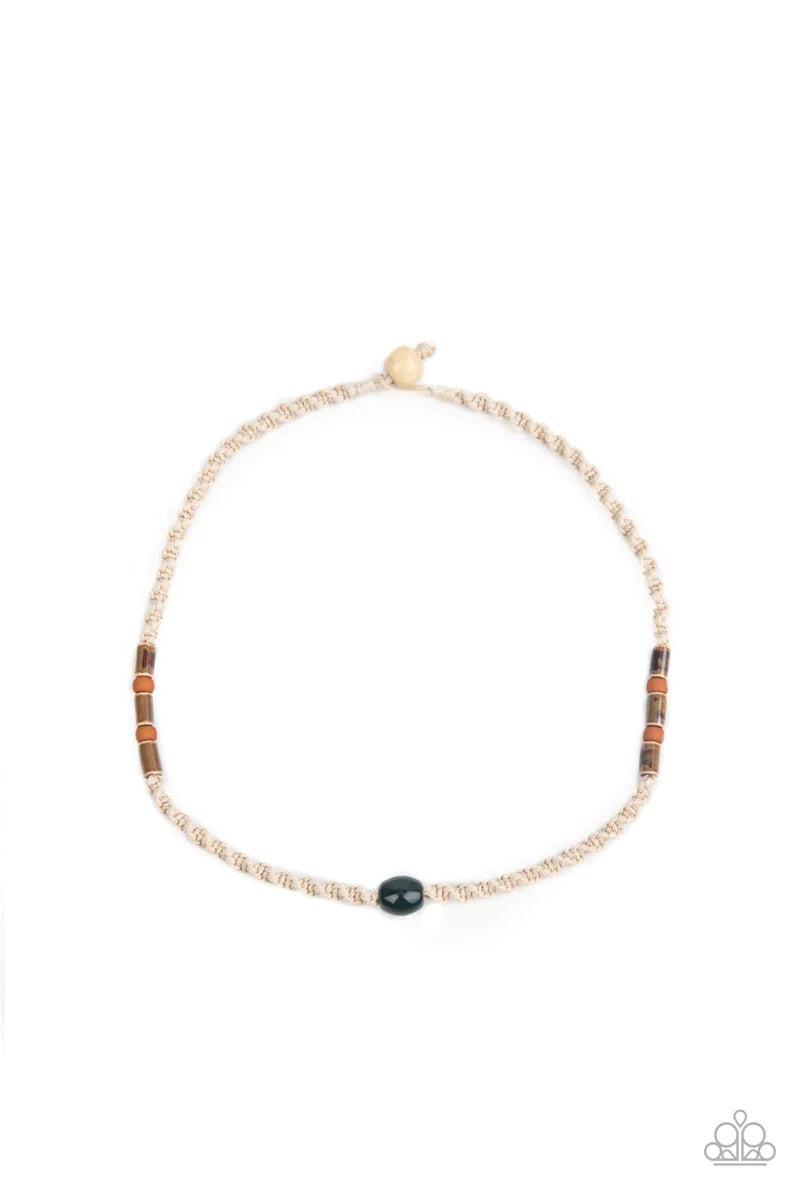 Paparazzi Accessories Positively Pacific - Green Featuring glazed, matte, and polished finishes, an earthy collection of brown and green beads are knotted in place along a braided twine-like cord below the collar, creating an authentically urban centerpie