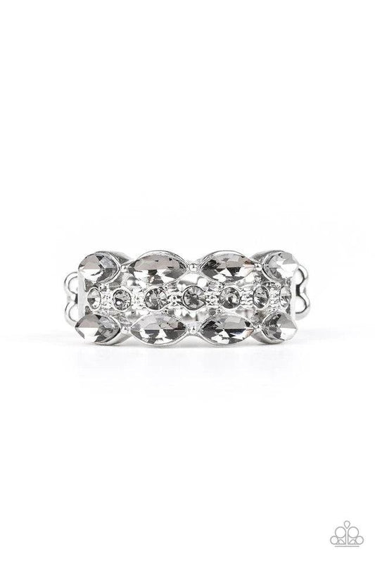 Paparazzi Accessories Distracting Demure - White Two rows of smoky marquise style rhinestones flank one row of dainty smoky rhinestones, coalescing into a timelessly layered piece. Features a dainty stretchy band for a flexible fit. Sold as one individual