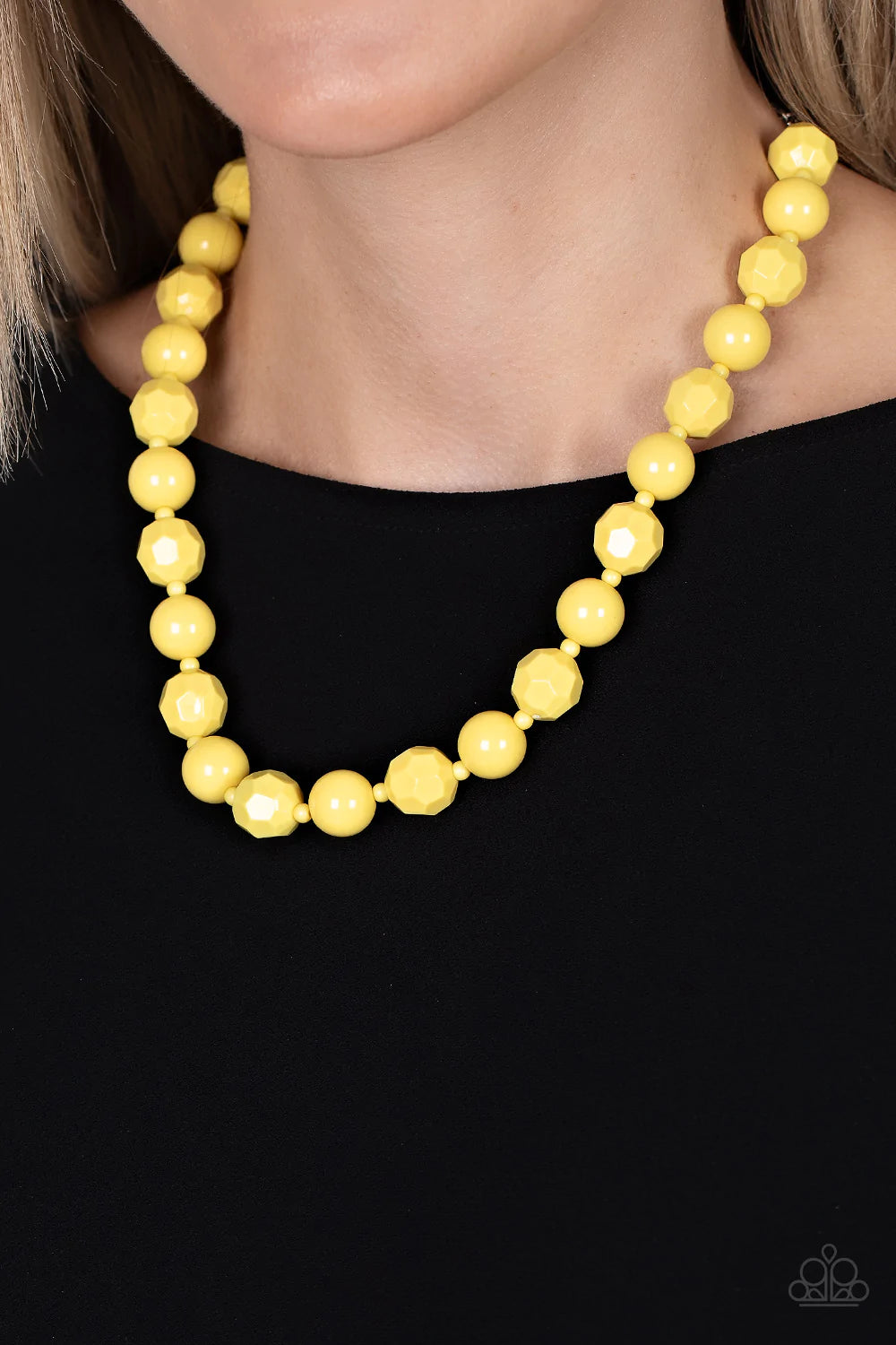 Paparazzi Accessories Popping Promenade - Yellow Infused with dainty yellow beads, a bubbly collection of smooth and faceted yellow beads alternate along an invisible wire below the collar for a sunny pop of color. Features an adjustable clasp closure. So