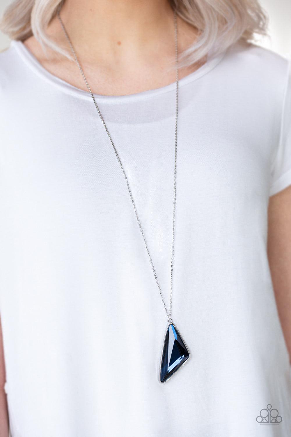 Paparazzi Accessories Ultra Sharp ~Blue Cut into a striking triangular shape, a faceted blue gem swings from the bottom of a lengthened silver chain for an edgy-glamorous fashion. Features an adjustable clasp closure.