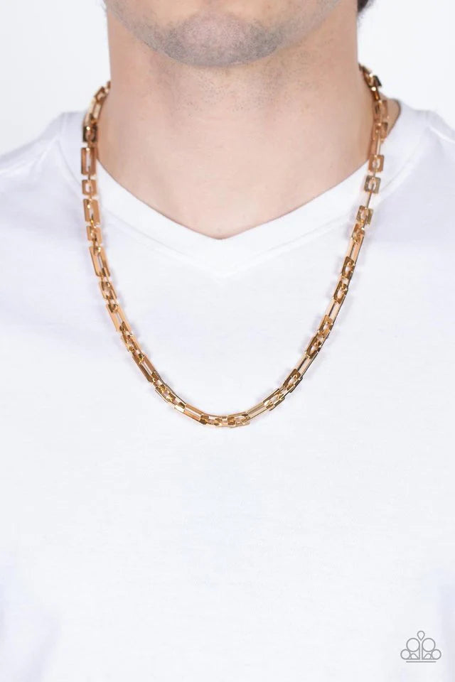 Paparazzi Accessories Rocket Zone - Gold A shiny assortment of flat rectangular and square gold links daringly interlocks across the chest, resulting in a bold industrial centerpiece. Features an adjustable clasp closure. Sold as one individual necklace.