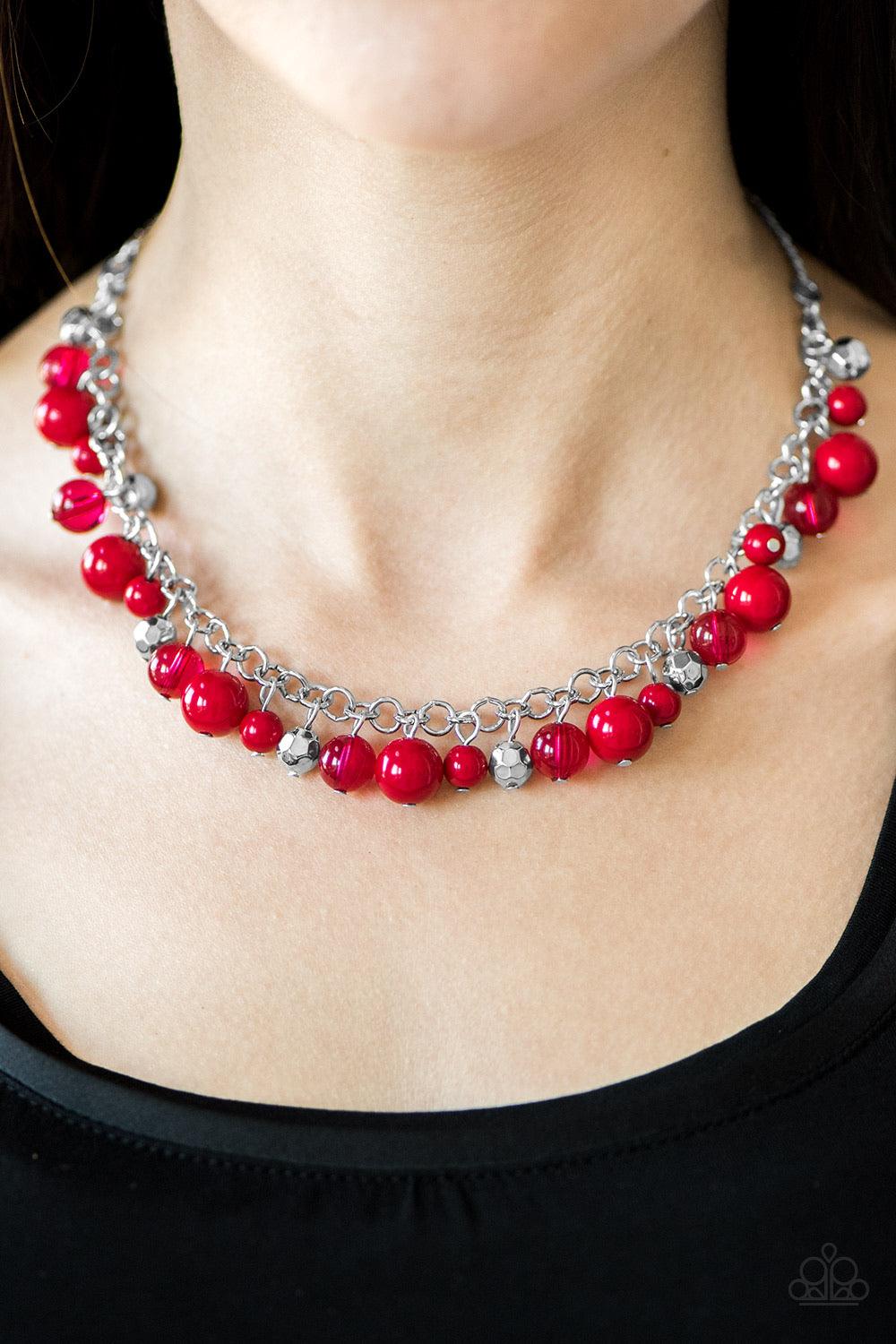 Paparazzi Accessories Wander With Wonder - Red Polished and opaque red beading trickle from a shimmery silver chain, creating a colorful fringe below the collar. Faceted silver beads are sprinkled between the colorful accents for a whimsical finish. Featu