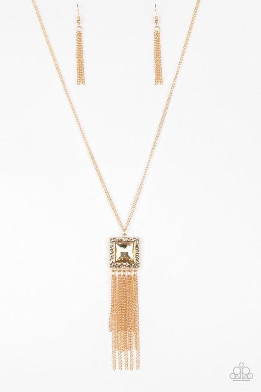 Paparazzi Accessories Shimmer Sensei - Gold Swinging from the bottom of a lengthened gold chain, a delicately hammered square frame gives way to a shimmery gold fringe. Featuring a regal square cut, a golden gem is pressed into the center of the pendant f