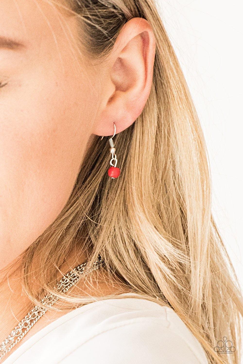 Paparazzi Accessories Laying The Groundwork - Red Infused with a plain silver chain, mismatched fiery red stone beads sporadically trickle along shimmery silver chains, creating vivacious layers down the chest. Features an adjustable clasp closure. Jewelr
