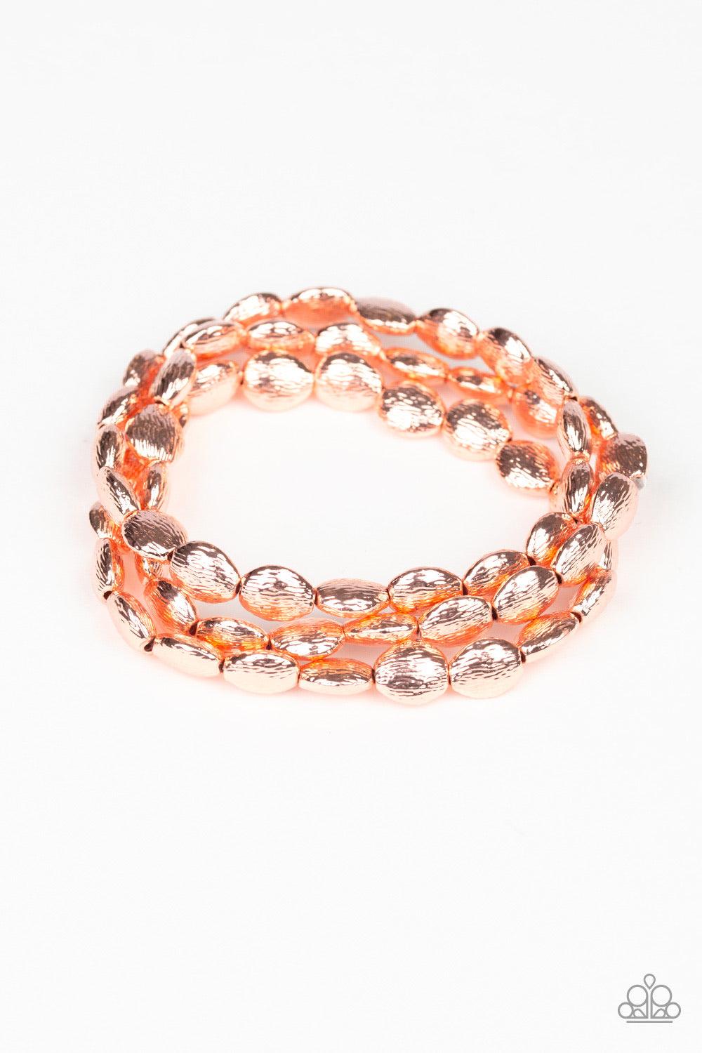 Paparazzi Accessories Basic Bliss - Copper Radiating with shimmery textures, dainty shiny copper beads are threaded along stretchy bands around the wrist for a casually layered look. Sold as one set of three bracelets. Jewelry
