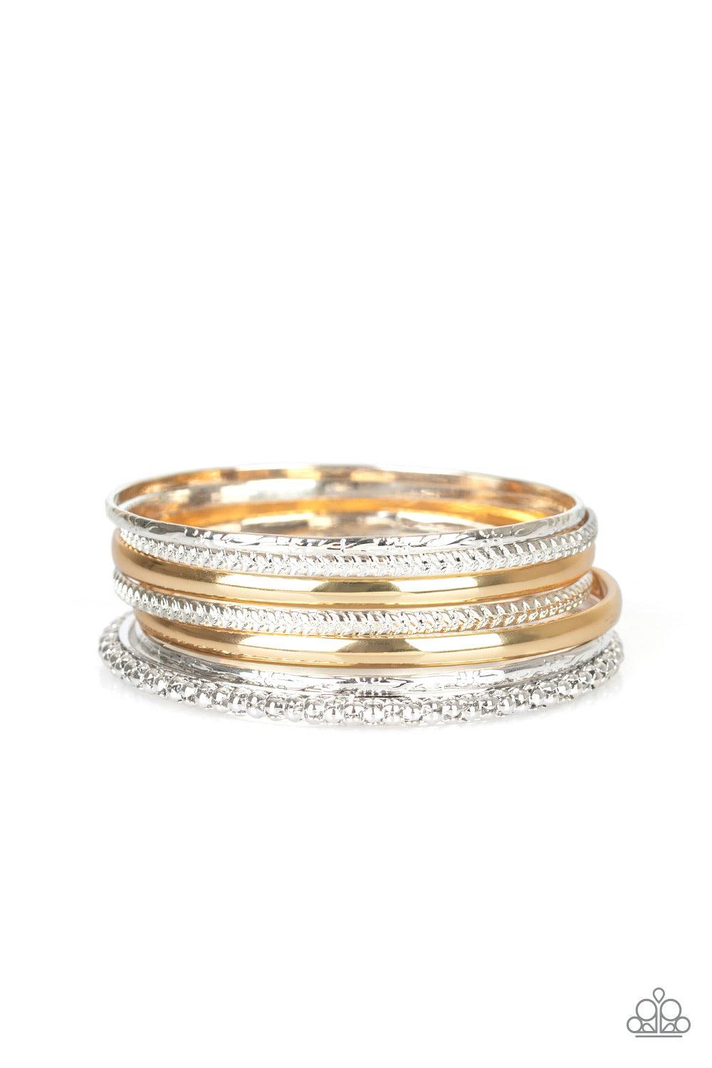 Paparazzi Accessories Hit The Stack - Silver Varying in texture and width, a collision of silver, and gold bangles slide up and down the wrist for a bold, industrial look. Jewelry