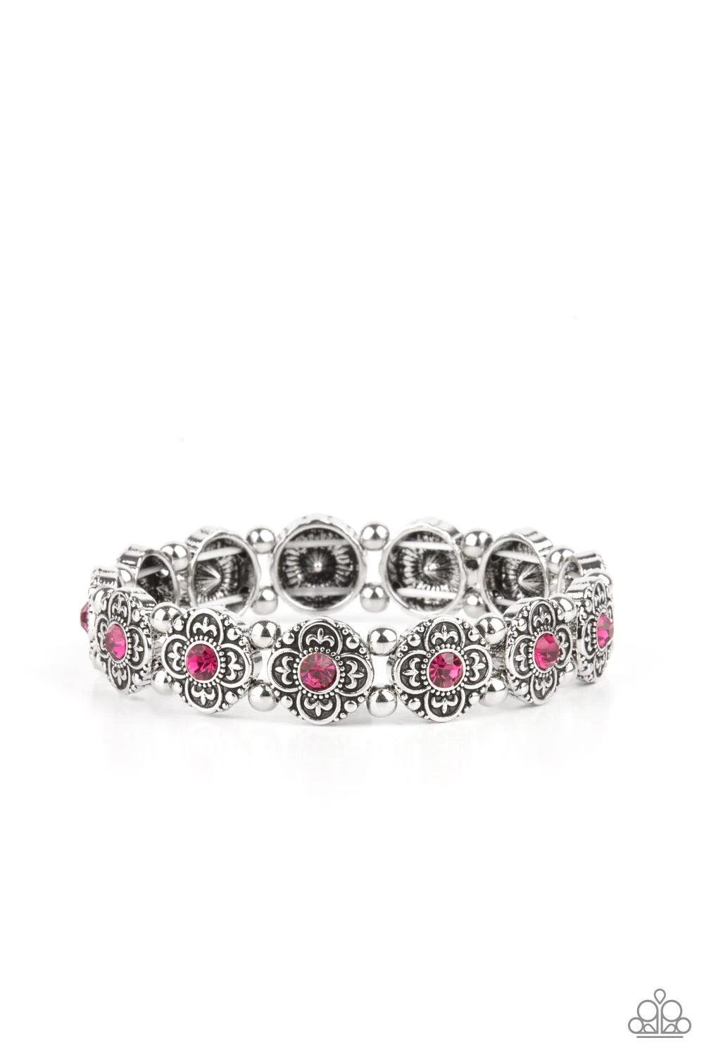 Paparazzi Accessories Tres Magnifique ~Pink Dotted with glittery pink rhinestone centers, antiqued silver floral frames and dainty silver beads are threaded along stretchy bands around the wrist for a seasonal twist. Sold as one individual bracelet. Jewel