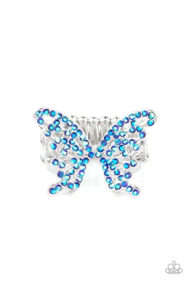 Paparazzi Accessories Butterfly Orchard - Blue Featuring an iridescent shimmer, dainty blue rhinestones adorn a silver butterfly atop the finger for an enchanted fashion. Features a stretchy band for a flexible fit. Jewelry