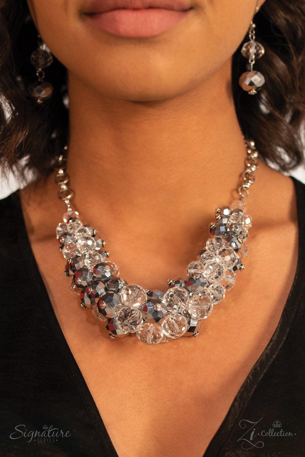 Paparazzi Accessories The Erika 💗ZiCollection $25💗 Sparkling crystal-like beading boldly collides with metallic beads featuring light-catching faceted edges to create a gorgeous pendant that falls just below the collar. The beads gradually increase in s