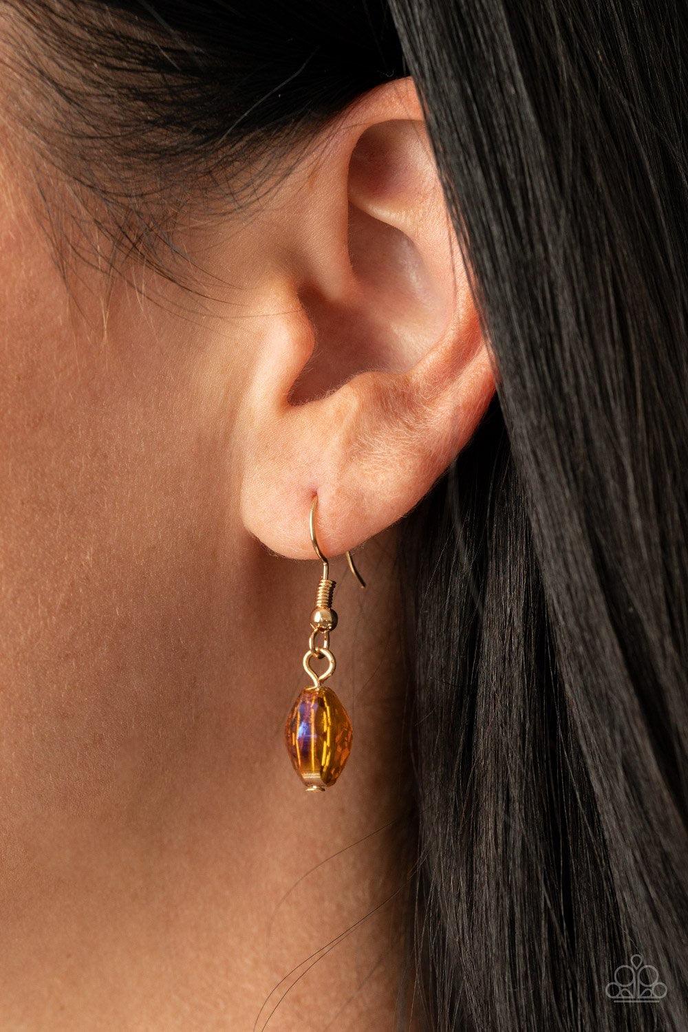 Paparazzi Accessories High Fashion Fashionista - Brown Hammered gold frames and imperfect gold ovals link with iridescent topaz gems below the collar, creating a colorful display. Features an adjustable clasp closure. Sold as one individual necklace. Incl