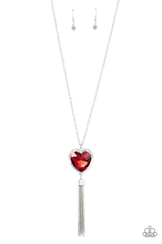 Paparazzi Accessories Finding My Forever - Red Bordered in a ribbon of glassy white rhinestones, an oversized red heart-shaped gem seemingly floats at the bottom of an extended silver chain. A shimmery silver chain tassel dances from the bottom of the spa