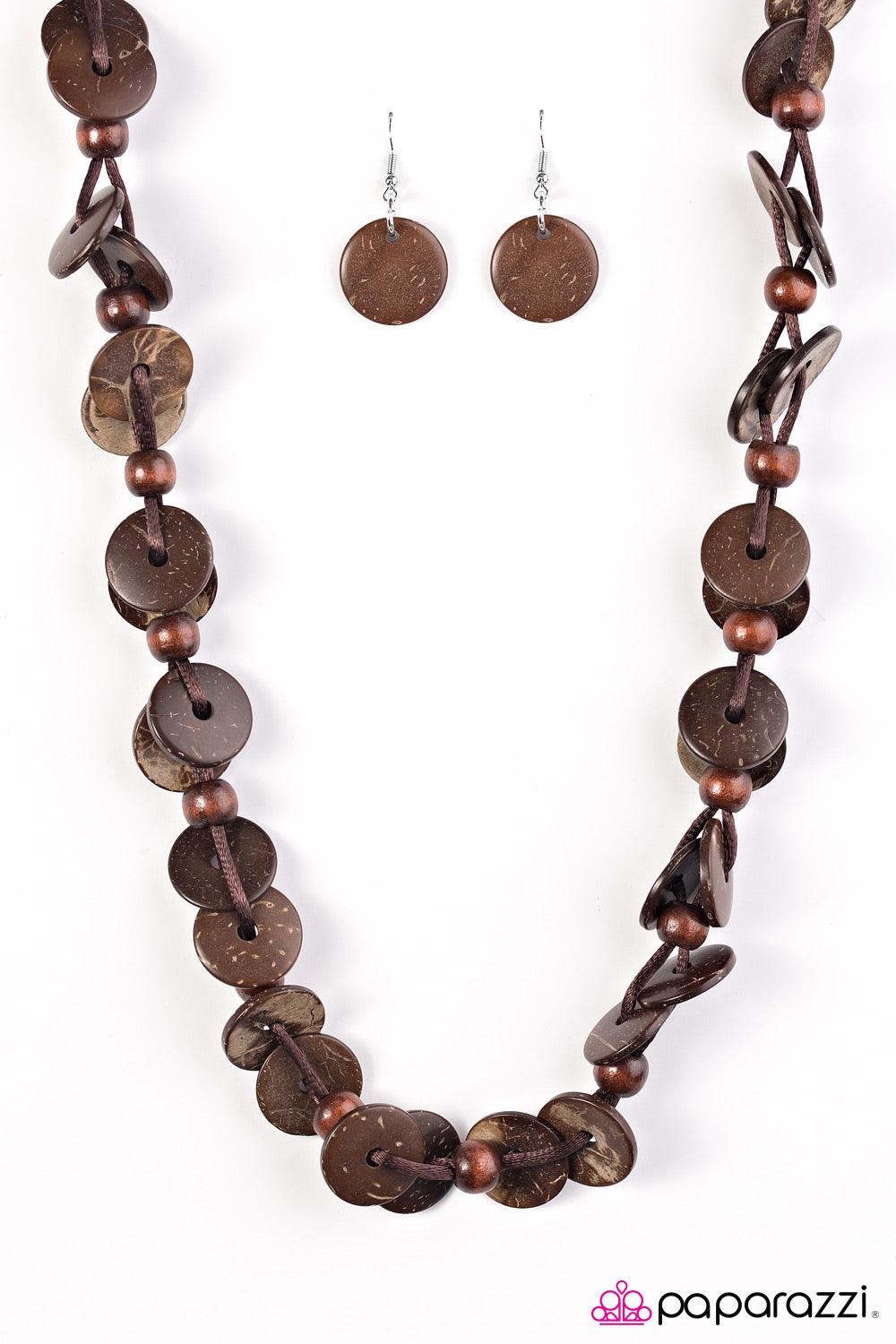 Paparazzi Accessories Caribbean Carnival - Brown Shiny wooden discs brushed in a brown finish trickle along shiny brown cording, creating two knotted layers. Brown wooden beads alternate along the earthy discs, adding an earthy flair to the summery palett