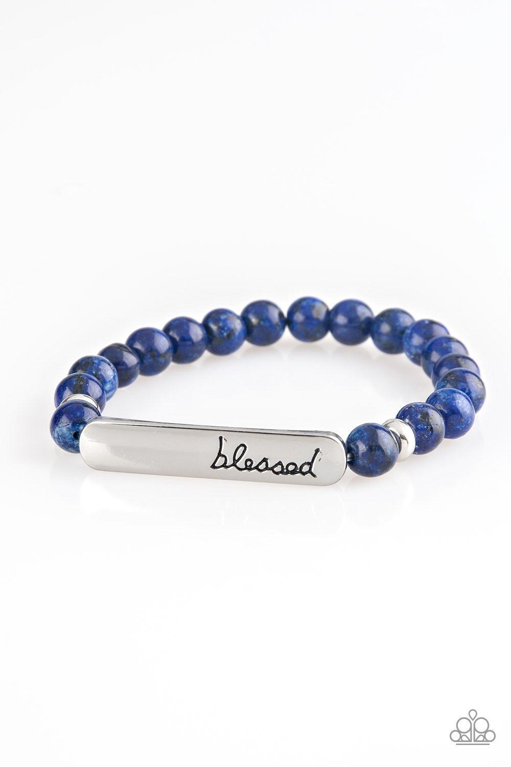 Paparazzi Accessories Born Blessed - Blue Infused with dainty silver accents, a collection of speckled blue stones are threaded along a stretchy band. A glistening silver frame engraved with the word, "blessed" adorns the center for a seasonal finish. Jew