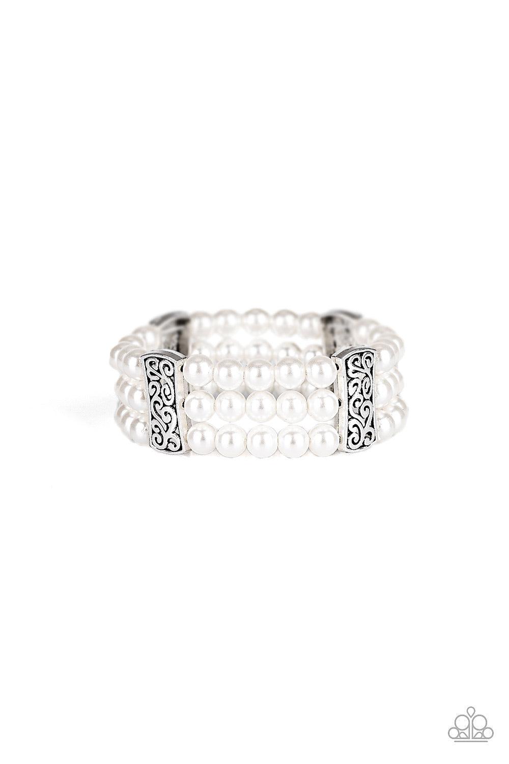Paparazzi Accessories Ritzy Ritz - White Infused with ornate silver frames, row after row of white pearls are threaded along stretchy bands around the wrist for a refined flair. Jewelry