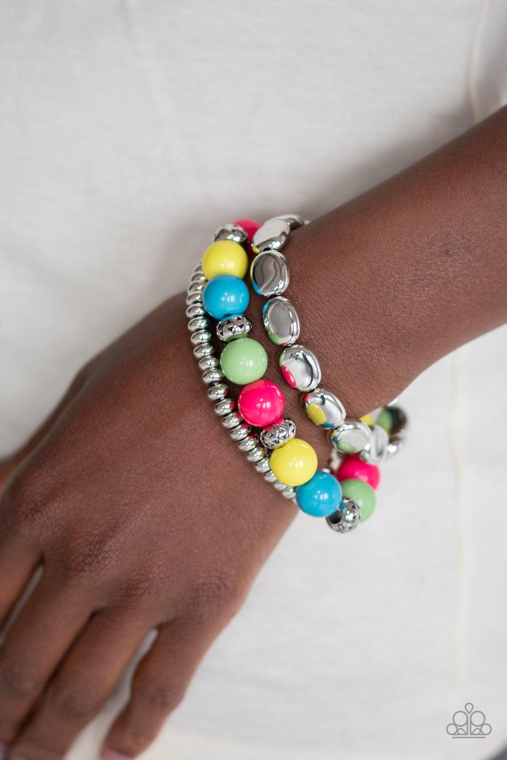 Paparazzi Accessories Prismatic Pop - Multi Varying in shape and size, a shiny collection of yellow, blue, green, pink, and silver beads are threaded along stretchy bands around the wrist for a vivaciously layered look. Jewelry