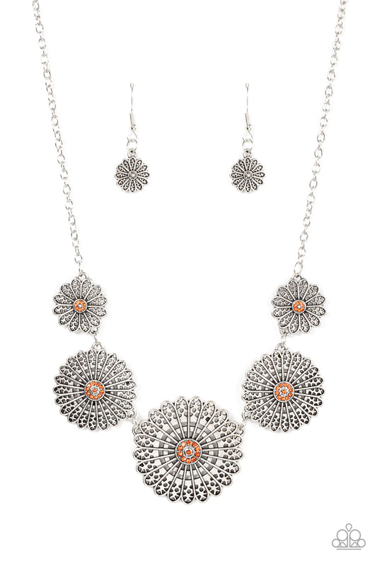 Paparazzi Accessories Marigold Meadows - Orange Infused with a whimsical mandala-like motif, tactile silver petals bloom from orange rhinestone dotted centers below the collar. The mismatched silver flowers gradually increase in size, exaggerating the eye