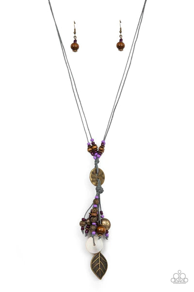 Paparazzi Accessories Knotted Keepsake - Purple An earthy assortment of purple and plum seed beads, rustic brass discs, and wooden accents glide along lengthy strands of gray cording that knot around a hammered brass disc. Tassels of matching beads, a whi
