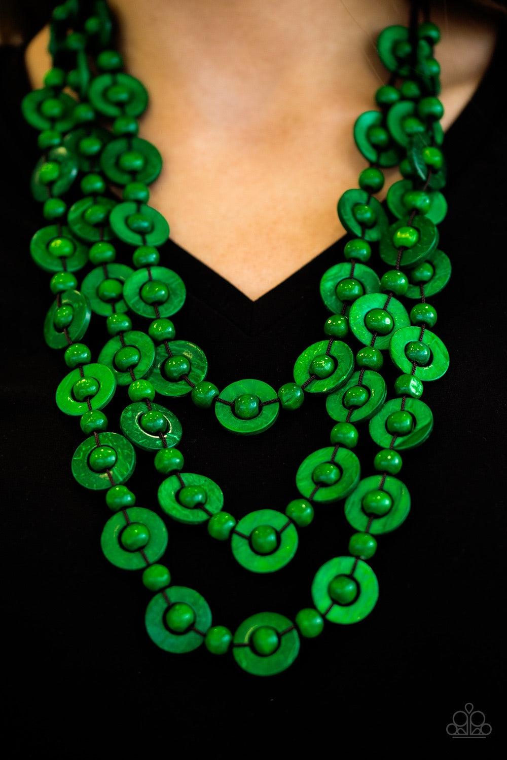 Paparazzi Accessories Bermuda Belle - Green Brushed in a refreshing green finish, wooden rings and beads are knotted in place along three strands, creating summery layers down the chest. Features a button loop closure. Jewelry