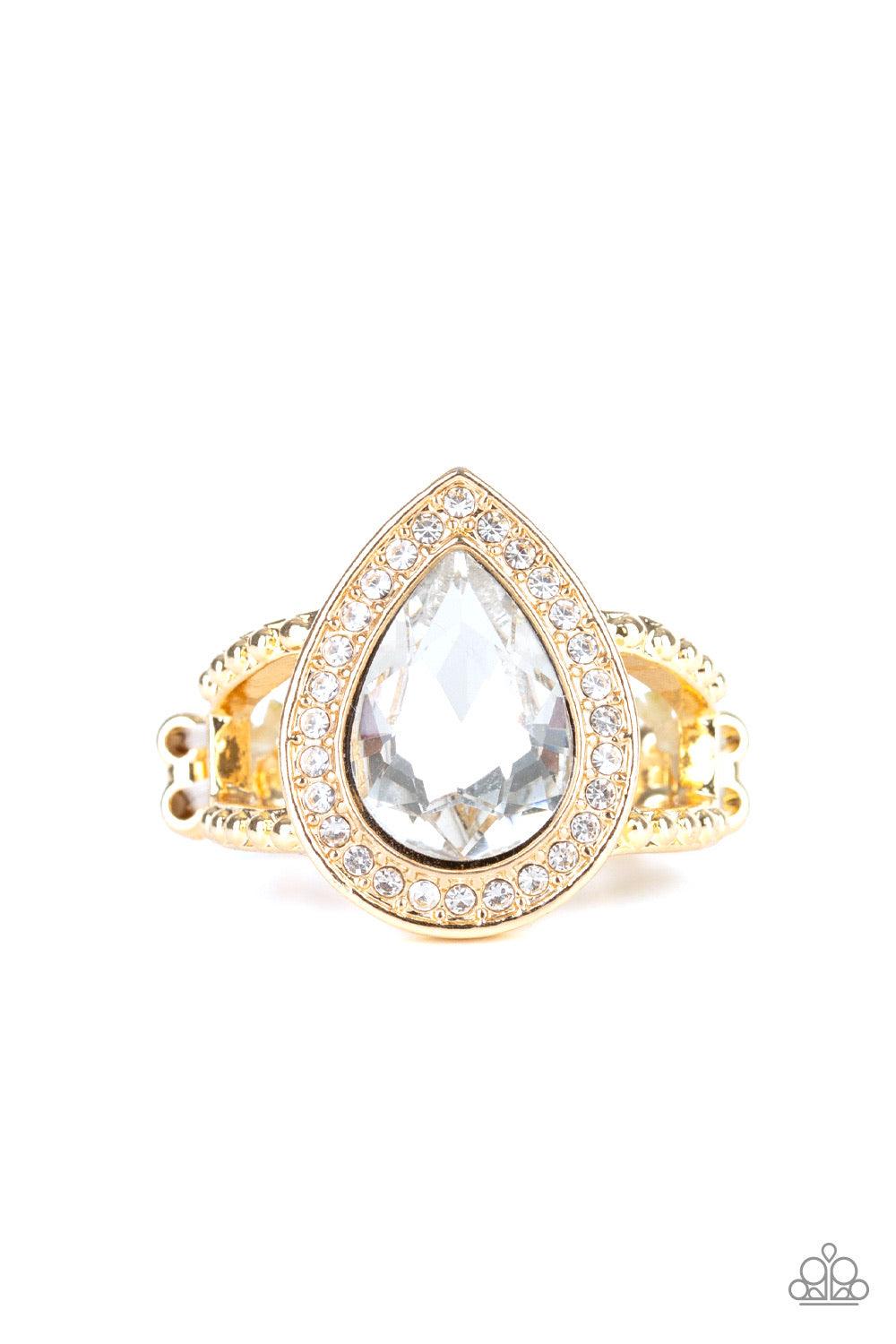 Paparazzi Accessories Hollywood Heirloom ~Gold A glassy white teardrop gem is pressed into a glistening gold frame encrusted in dainty white rhinestones, creating a glamorous frame atop the finger. Features a dainty stretchy band for a flexible fit.