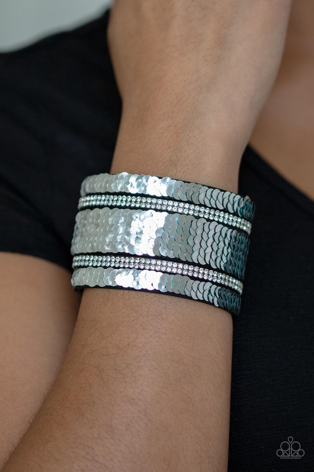 Paparazzi Accessories Mermaid Service - Green Infused with strands of blinding white rhinestones, row after row of shimmery sequins are stitched across the front of a spliced black suede band. Bracelet features reversible sequins that change from silver t