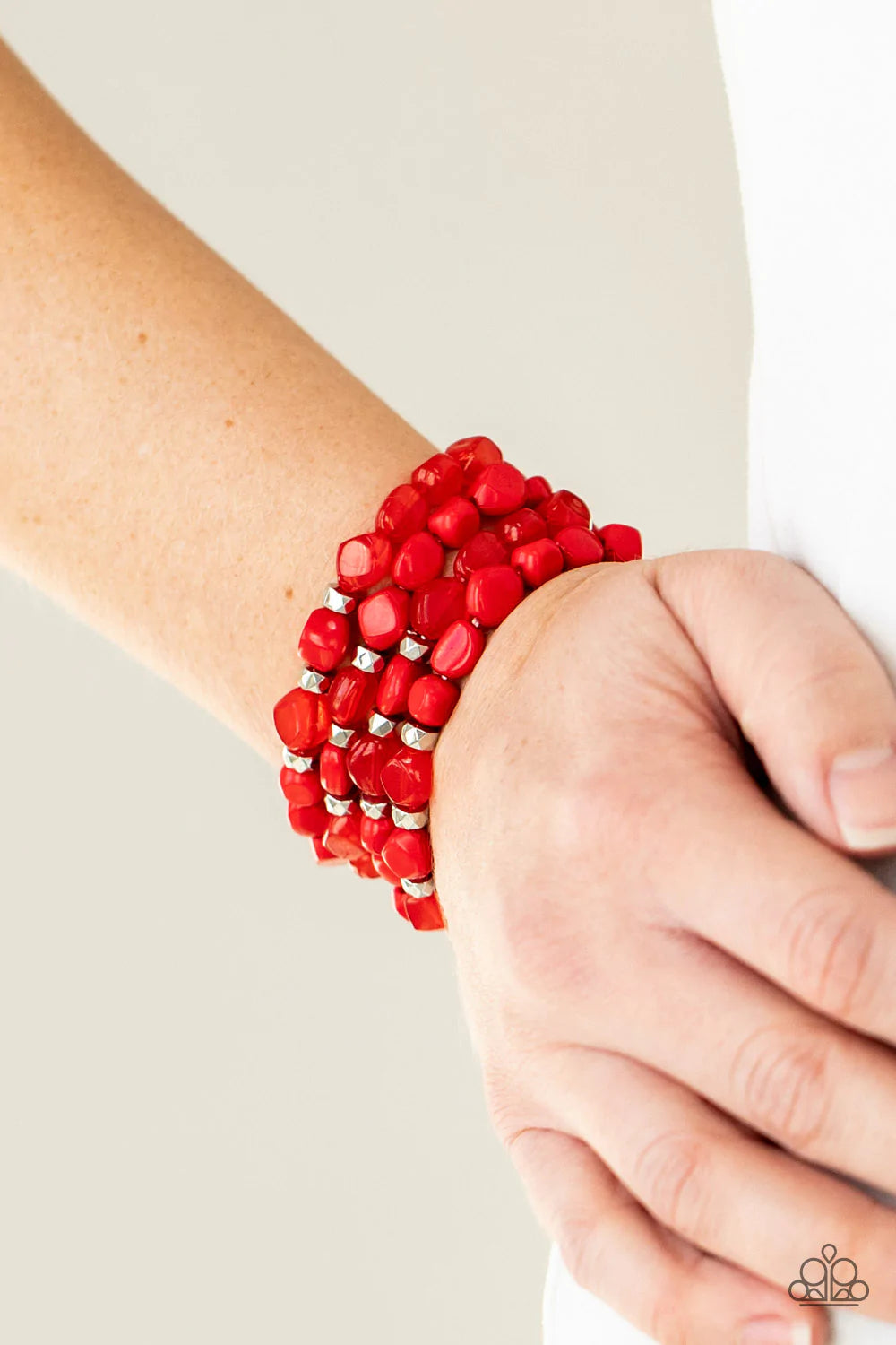 Paparazzi Accessories Nice GLOWING! - Red Bright red irregular shaped beads in varying opacities, accented with shining faceted silver beads are threaded along stretchy bands and stack up the wrist for a glowing display. Sold as one individual bracelet. J