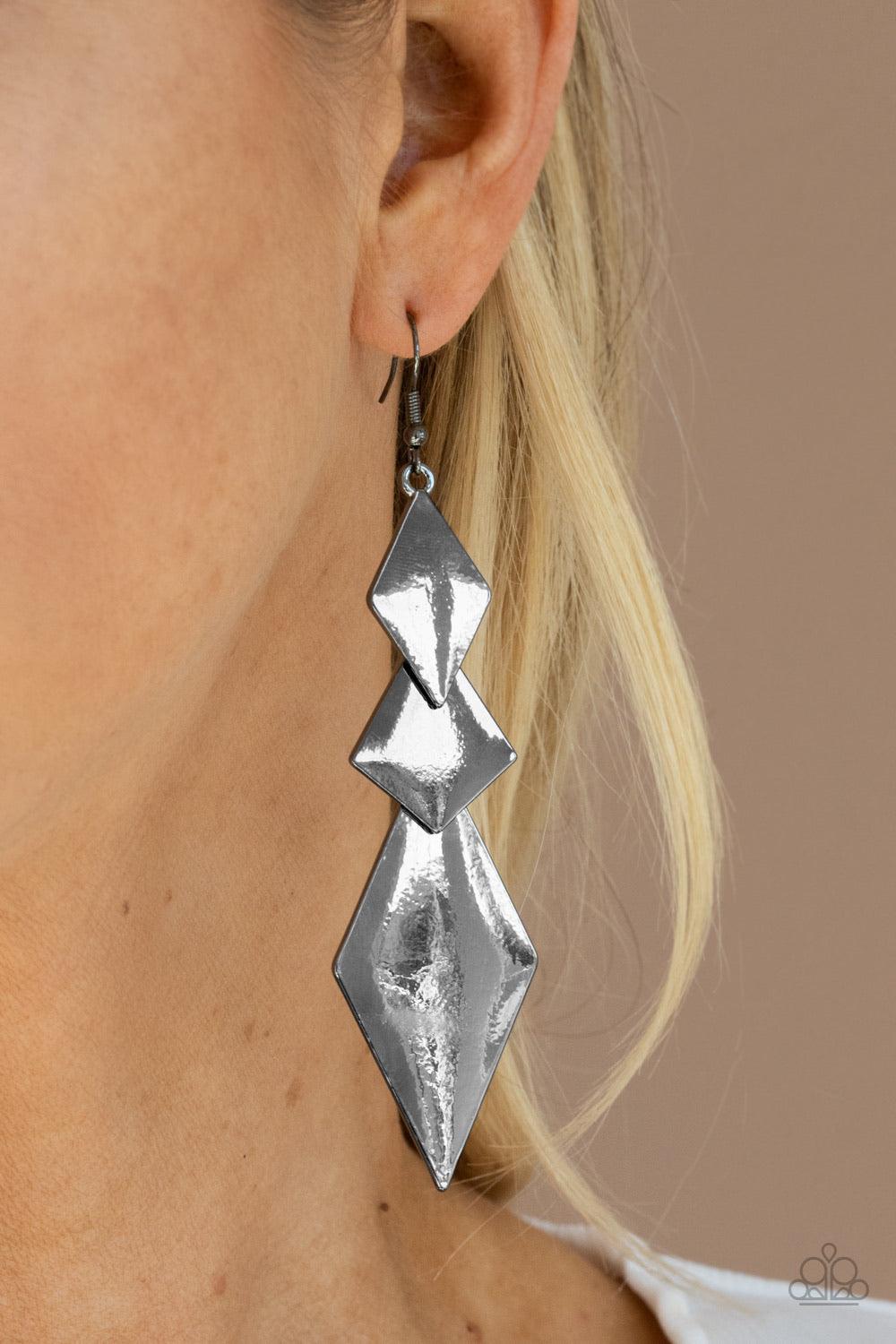 Paparazzi Accessories Danger Ahead - Black A trio of shiny mismatched kite-shaped frames overlap into a sharp-looking lure. Earring attaches to a standard fishhook fitting. Sold as one pair of earrings. Jewelry