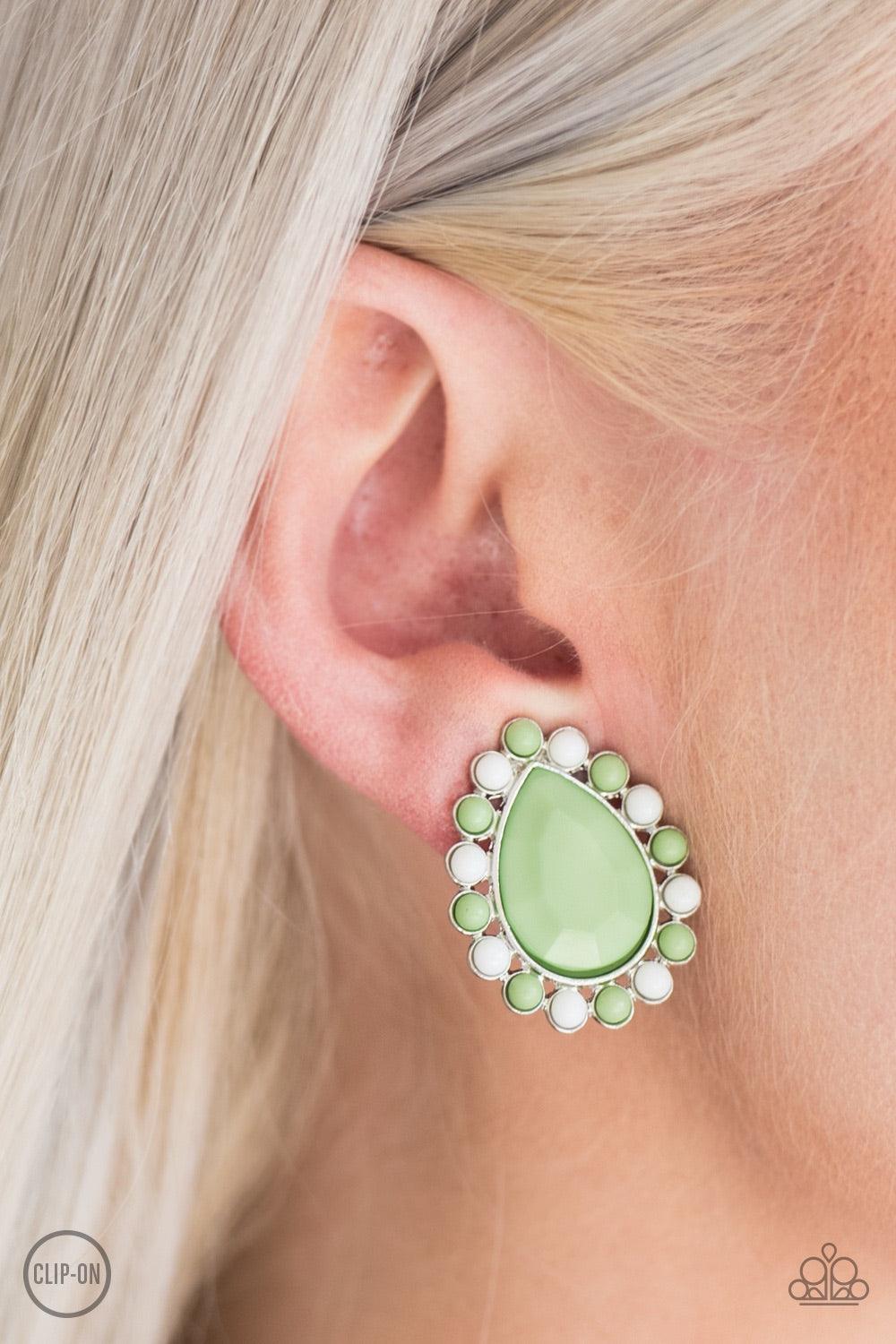 Paparazzi Accessories So Spring Season - Green *Clip-On Dainty white and green beads spin around a faceted green teardrop, creating a colorful frame. Earring attaches to a standard clip-on fitting. Jewelry