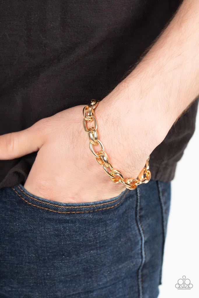 Paparazzi Accessories Rookie Roulette - Gold A chunky collection of bold shiny gold links interlock around the wrist, creating an intense industrial centerpiece. Features an adjustable clasp closure. Jewelry