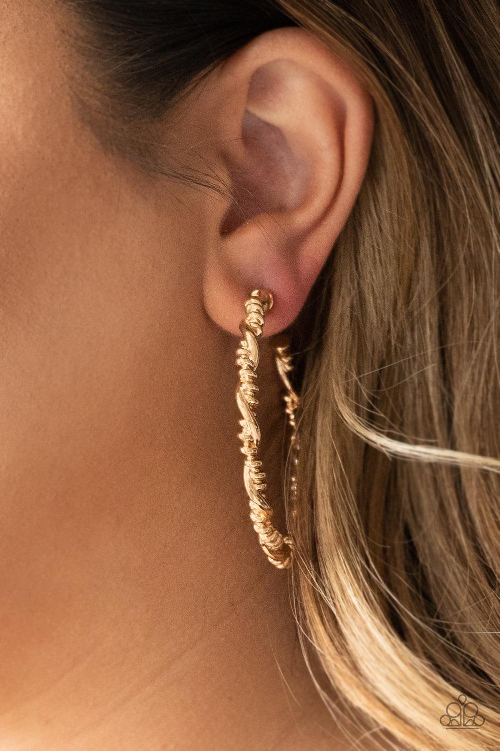Paparazzi Accessories Street Mod - Gold Glistening gold bars wrap into an edgy twisted hoop for a casual look. Earring attaches to a standard post fitting. Hoop measures 2" in diameter. Jewelry