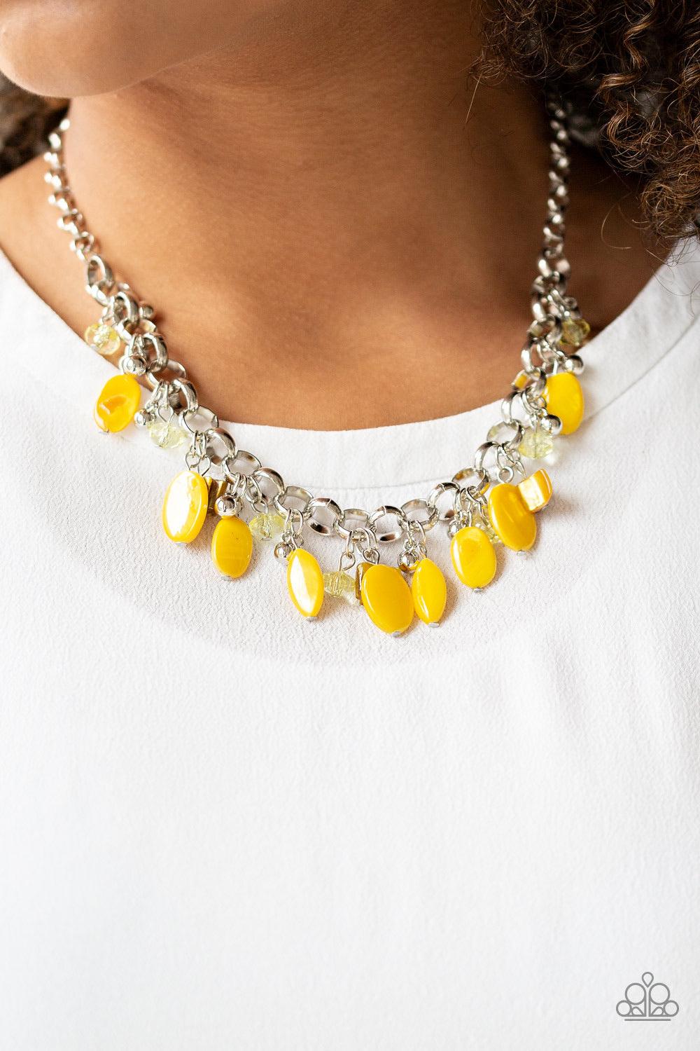 Paparazzi Accessories I Want To SEA The World - Yellow A collection of yellow shell-like beads, yellow crystal-like beads, and shiny silver beads swing from a bold silver chain, creating a whimsical fringe below the collar. Features an adjustable clasp cl