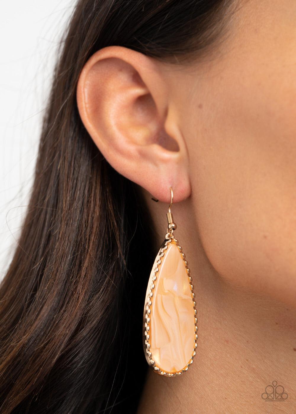 Paparazzi Accessories Ethereal Eloquence - Gold Featuring a shell-like shimmer, a golden faux marble acrylic teardrop is encased into a studded gold frame for an ethereally refined fashion. Earring attaches to a standard fishhook fitting. Sold as one pair