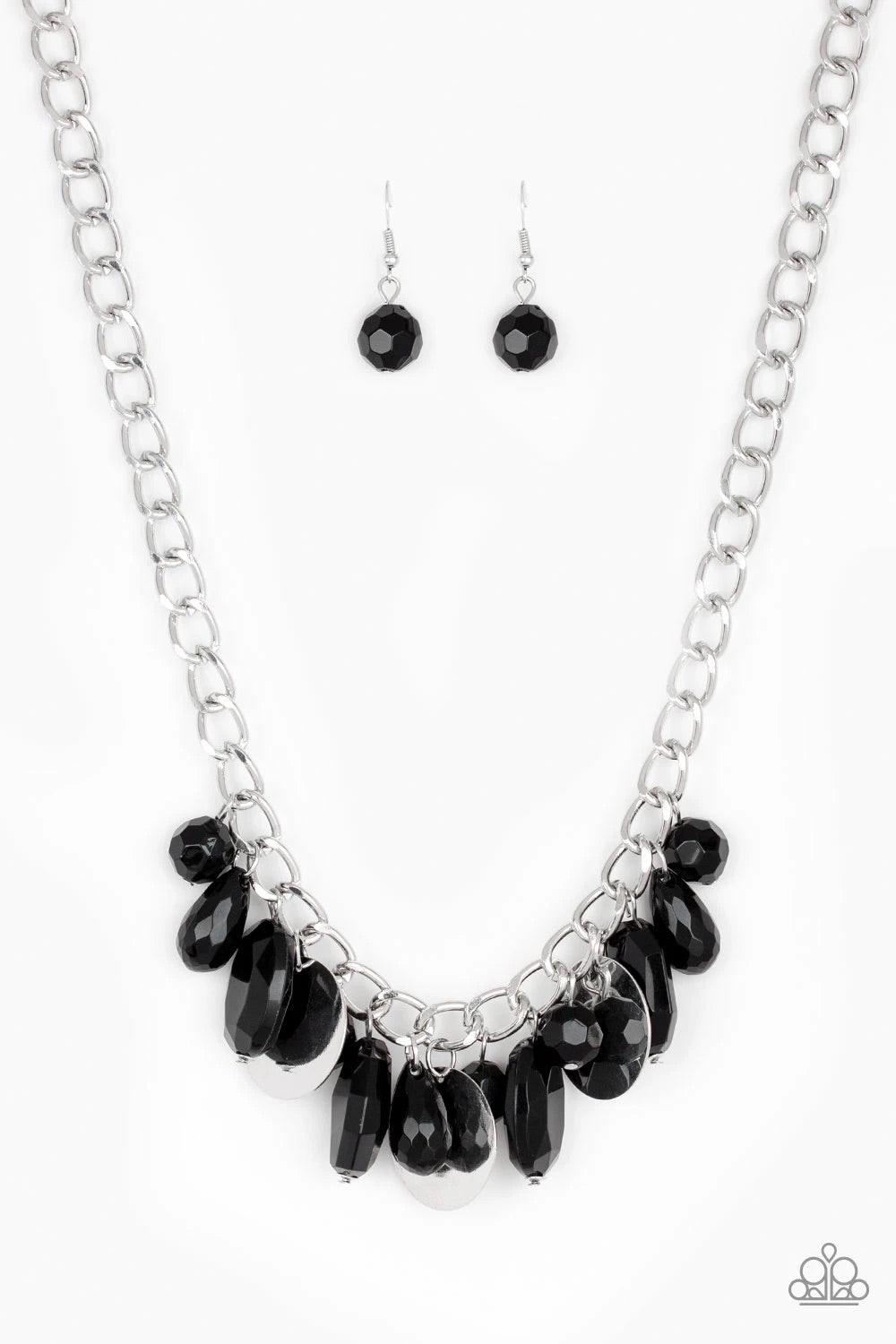 Paparazzi Accessories Treasure Shore - Black A collection of glassy black beads swings playfully from the bottom of a dramatic silver chain. Glistening silver discs trickle between the colorful beads, creating a refreshing fringe below the collar with shi